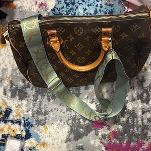 mint-colored strap with gold details